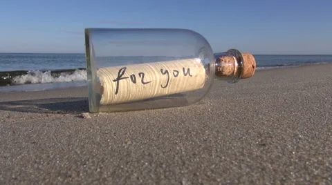 Message in a bottle with words “for you” on the beach Stock Footage 57472398