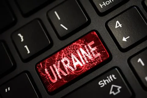Message on broken red enter key of keyboard. Computer Ukraine war attack warn Stock Photos