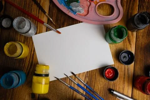 Message card in the middle with painting elements in the background on a wo.. Stock Photos
