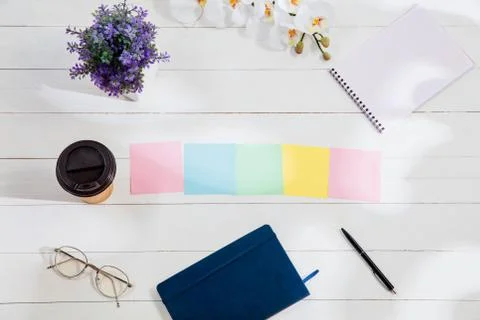 Message at colorful note papers on a desk background. Stock Illustration