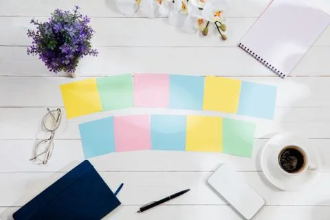 Message at colorful note papers on a desk background. Stock Illustration