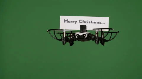 Message delivery by drone : season's greetings on a green screen Stock Footage 99339485