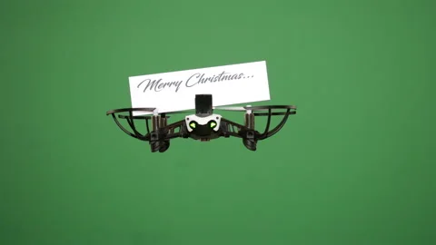 Message delivery by drone : season's greetings on a green screen Stock Footage 99341943