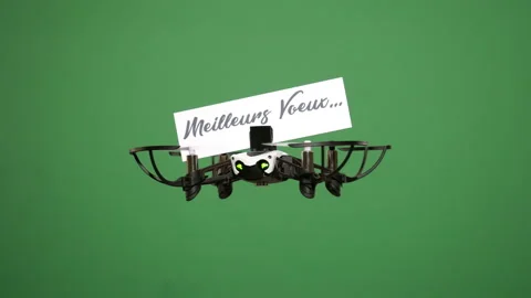 Message delivery by drone : season's greetings, in french, on a green screen Stock Footage 99342913