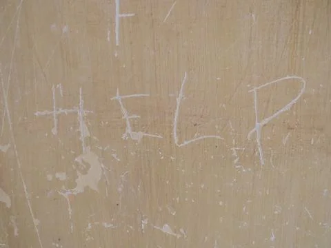 Message of Despair - Help etched onto the wall at S21 Tuol Sleng Prison Stock Photos
