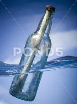 Message in a floating bottle Stock Photos