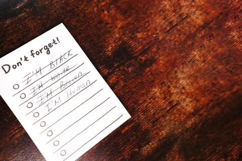 Message I'm human don't forget on wood desk Stock Photos