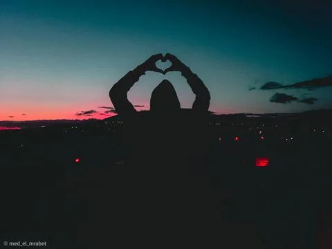 A message of love and support for the world with a massive sunset Stock Photos