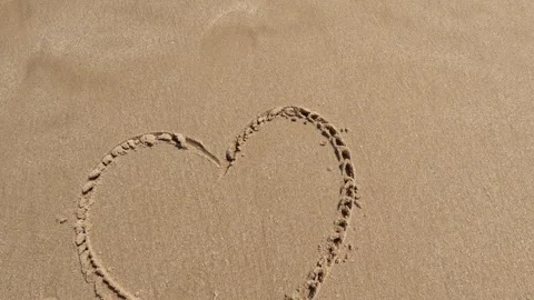 The message'' love '' on the sand with hand drawing on the beach 動画素材 245710697
