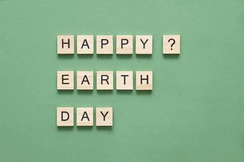 Message questioning whether Earth Day is a date of celebration, a happy day. Stock Photos