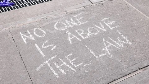 Message reads "No one is above the law" near Manhattan Criminal Courthouse Stock Footage 245943703