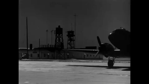A message is typed and telephoning is shown in a radio room at an airbase during 動画素材 90459324