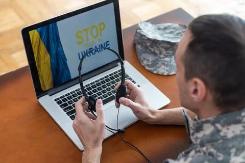 Message for world peace. military with laptop and flag of ukraine Stock Photos