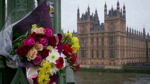 MESSAGES FLOWERS LEFT IN WESTMINSTER BRIDGE LONDON Stock Footage 80537070