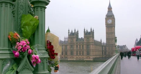 MESSAGES FLOWERS LEFT IN WESTMINSTER BRIDGE LONDON Stock Footage 80682265
