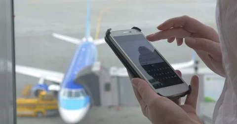 Messaging on phone during the flight waiting Stock Footage 53324340