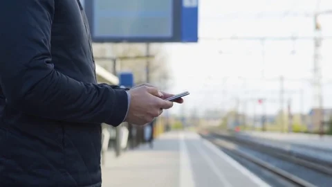 Messaging while waiting for the train Stock Footage 85224456