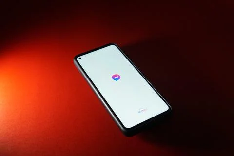 Messenger application logo on smartphone android system. Stock Photos