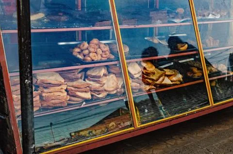 Messy bakery showcase with leftover bread Stock Photos