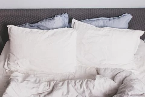 Messy bed with two pillows close-up, Stock Photos