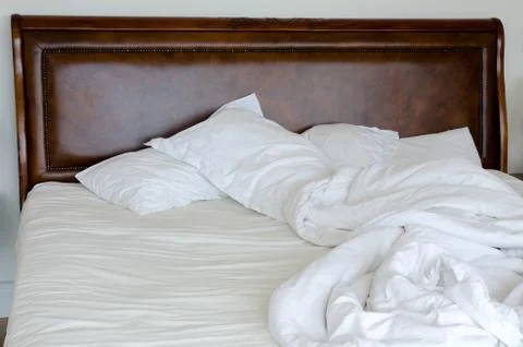 A messy bed which hasn't been made Stock Photos