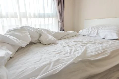 Messy bedding sheets and pillow Foto stock