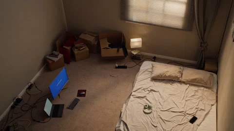 Messy Bedroom Interior Showing Computer Setup after Relocation Stock Footage 346609894