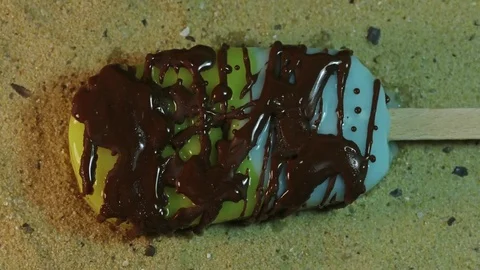 Messy Chocolate Covered Popsicle Melts Stock Footage 75679727