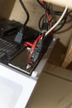 Messy Computer Cables and Internet Network Wires Connected to PC Back Panel.. Stock Photos
