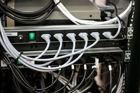 Messy connection computer and LAN cables power cord plugs. close up shot no p Fotos de archivo