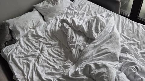 Messy crumpled empty bed top view Stock-Footage 310856642