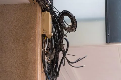Messy electrical cables installed on residential building 写真素材