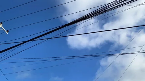 Messy electrical wires in a small town With blue cloudy sky Stock Footage 290822444