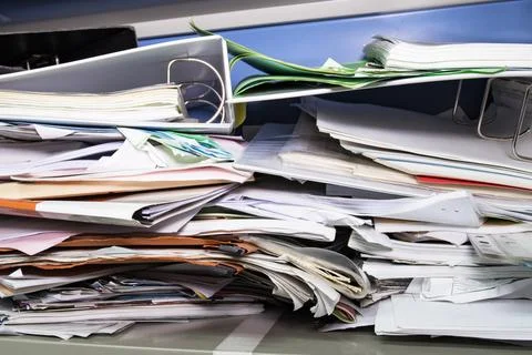 Messy file document and Office Supplies in filing cabinets at work office Photos
