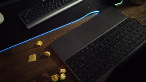 Messy Gaming Desk with Snacks and Keyboards Showing Screen Addiction Stock Footage 342022793