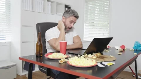 Messy junk office break time for lazy worker man. Messy junk office job pressure Stock Footage 326353171
