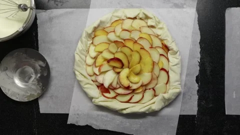 Messy kitchen countertop during creative process of baking fruit pastry Stock Footage 336848398