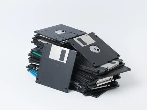Messy Pile of Old Floppy Disks Isolated on White Background Foto stock
