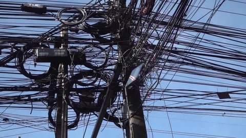 Messy power wires are tangled on the electrical pole Stock Footage 317237501