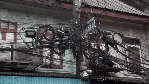 Messy power wires are tangled on the electrical pole, Stock Footage 344851591
