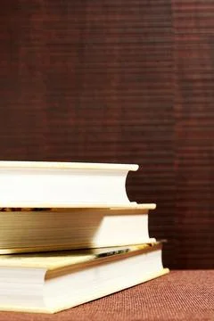 Messy stack of books on the brown bookshelf in the library Foto stock