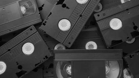 Messy stack of VHS tapes. Video Home System tape cassettes. Stock Footage 195093030