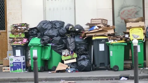 Messy streets with overfull garbage bins during binmen strike in Paris, France Stock Footage 316893281
