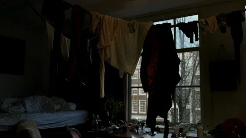 Messy student apartment with laundry hanging indoors in Amsterdam Stock-Footage 334785436