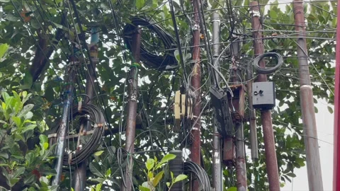 Messy tangled electrical and communication cables 動画素材 344112424