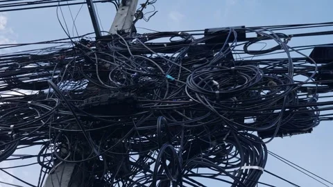 Messy tangled electrical power cables and wires on utility pole Stock Footage 319522878