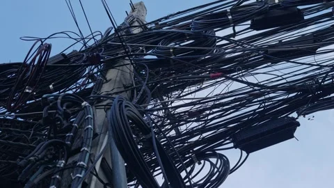 Messy tangled electrical power cables and wires on utility pole Stock Footage 323901900