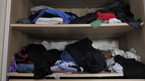 Messy wardrobe with bulk clothes Stock Footage 141496793