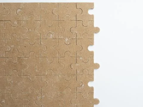 Messy wood jigsaw puzzles on white background Stock Photos