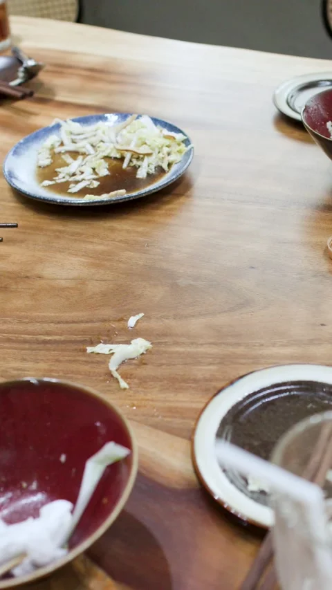 Messy Wooden Restaurant Table with Empty Bowls and Dirty Dishes Stock Footage 346195211